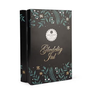 Amundsen Julekalender Belgisk konfekt med elegant design, dekorert med grønne og gyldne elementer, perfekt som adventsgave eller til å unne seg selv.