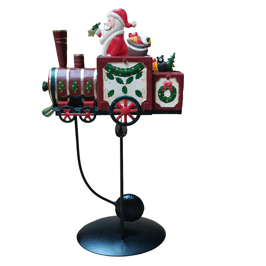 Håndmalt julefigur av Nissefar på tog fra Christiania 1739 Julekolleksjon, høyde 37 cm, med fargerike dekorasjoner og gyngende bevegelse.