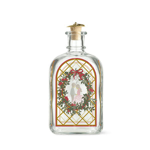 Holmegaard Christmas Juleflaske 2025 med romantisk juledekorasjon, designet av Jette Frölich. Flaske med illustrasjoner av julens symboler, perfekt for julesnaps.