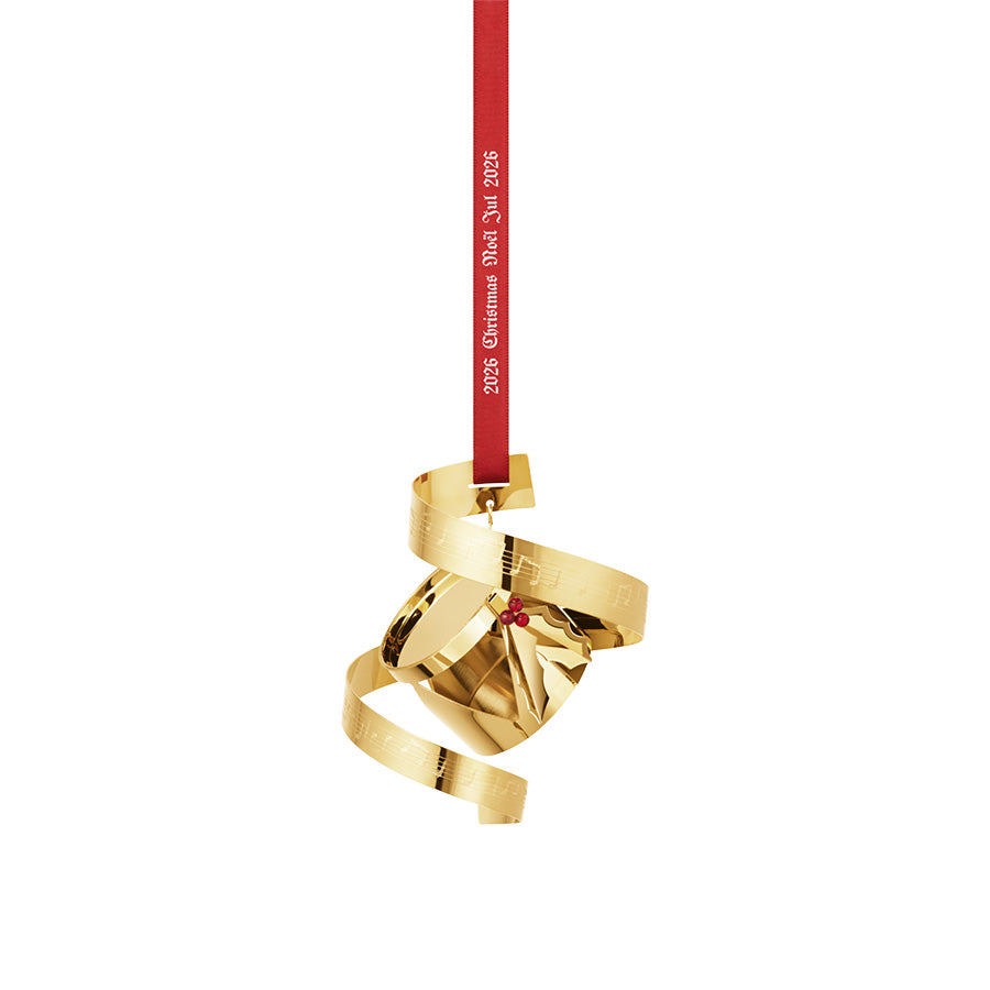 Georg Jensen juleuro 2026 formet som en tromme med notebånd i 18 kt forgylt messing