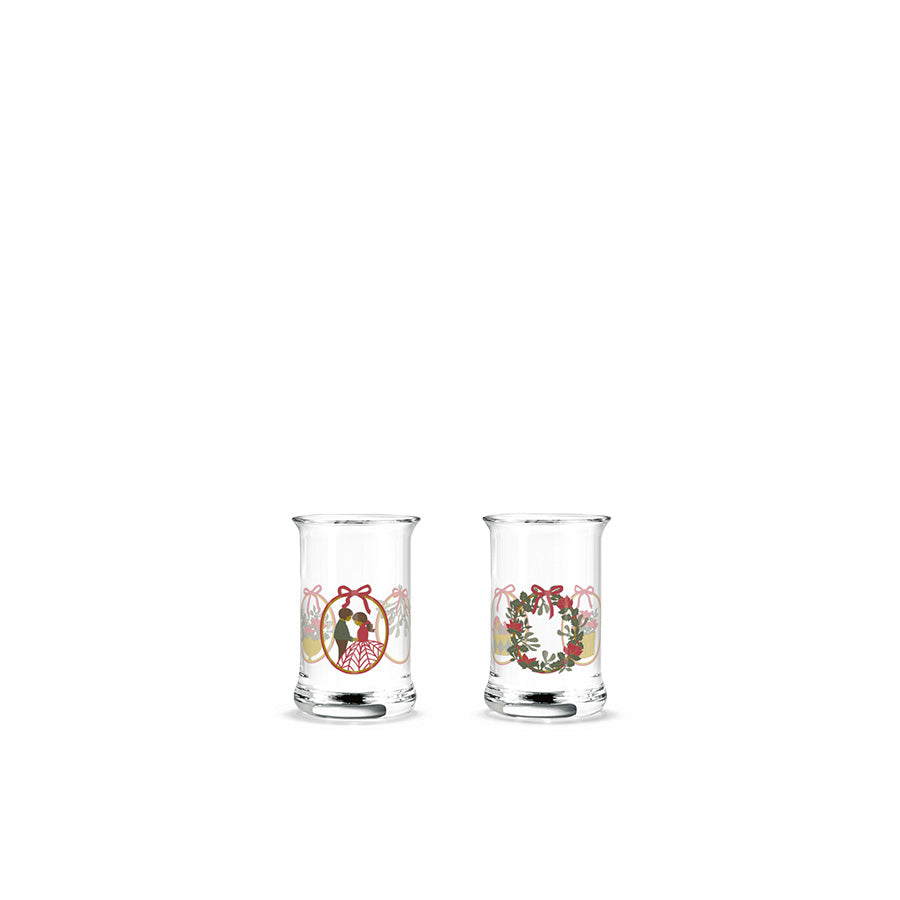 Holmegaard Christmas Juledrammeglass 2025 sett med to glass med nostalgiske julemotiver, designet av Jette Frölich, perfekt for å feire julen.