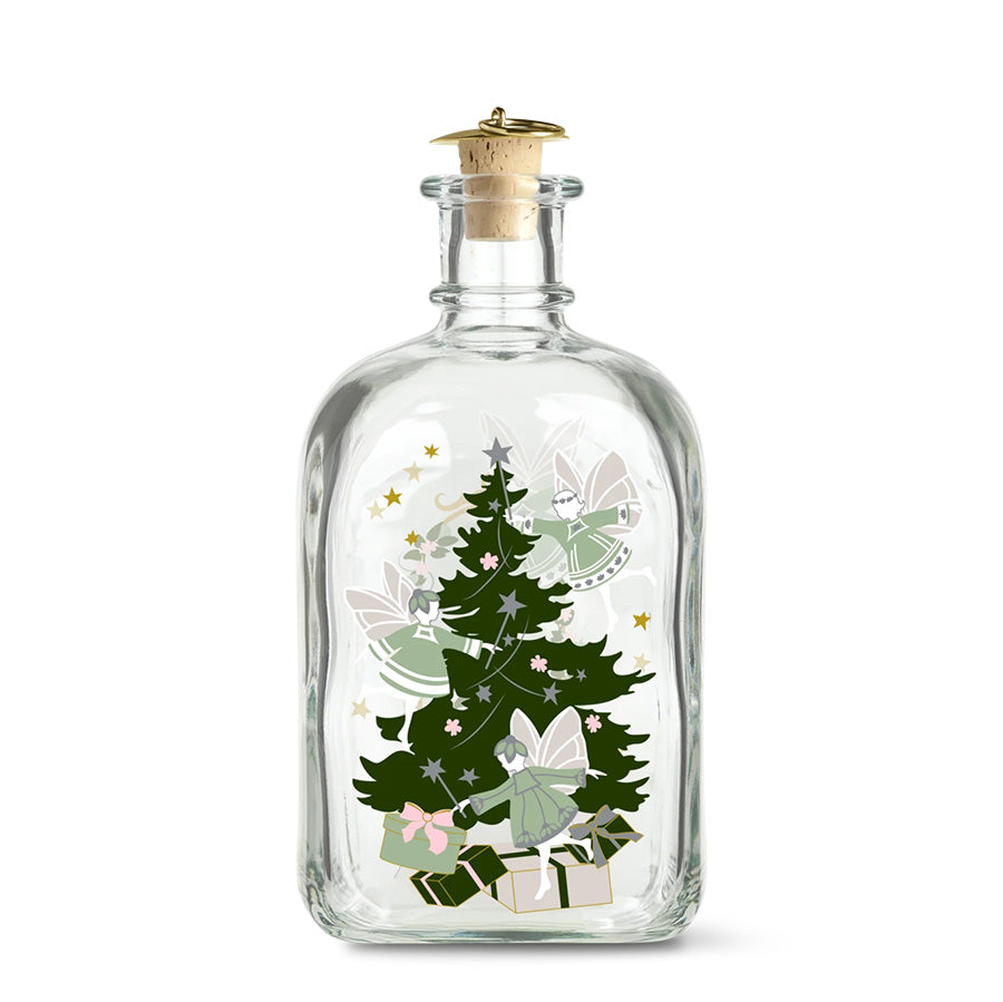 Holmegaard Christmas 2026 juleflaske i klart glass med korkpropp og dekorative juletrær, feer og gaver