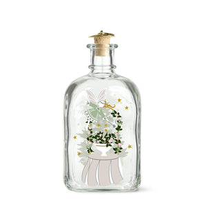 Holmegaard Christmas 2026 juleflaske i klart glass med julemotiv av fe, blomster og gullstjerner