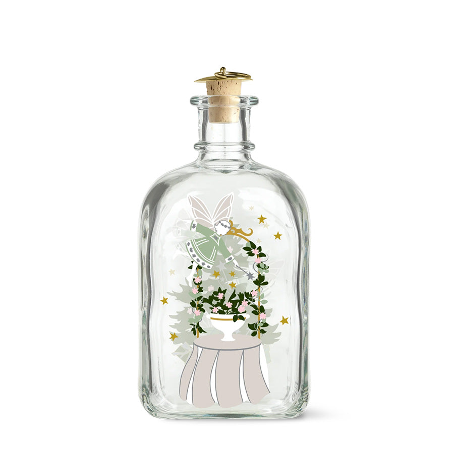 Holmegaard Christmas 2026 juleflaske i klart glass med julemotiv av fe, blomster og gullstjerner