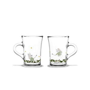 To Holmegaard Christmas 2026 hotdrink glass i klart glass med dekorative julemotiver og feer