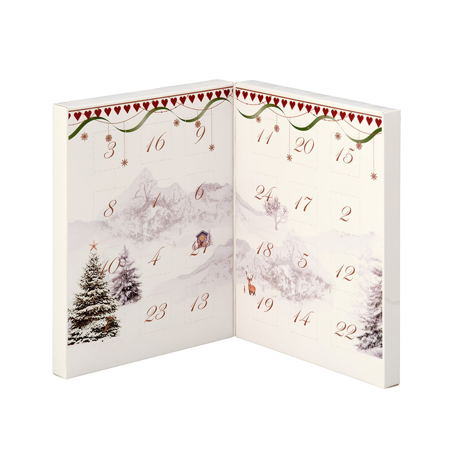 Åpen Julemorgen sjokoladekalender med 24 nummererte luker og vintermotiv