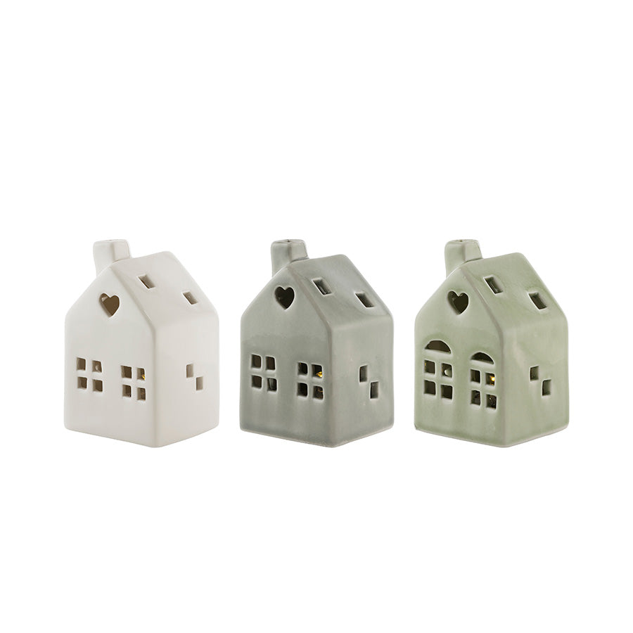 Tre porselenshus med LED-lys fra Porsgrunds Porselænsfabrik, perfekte for juledekorasjon, skaper en koselig atmosfære med varm belysning - PP Jul Mini Hus M/ LED Lys 3pk.