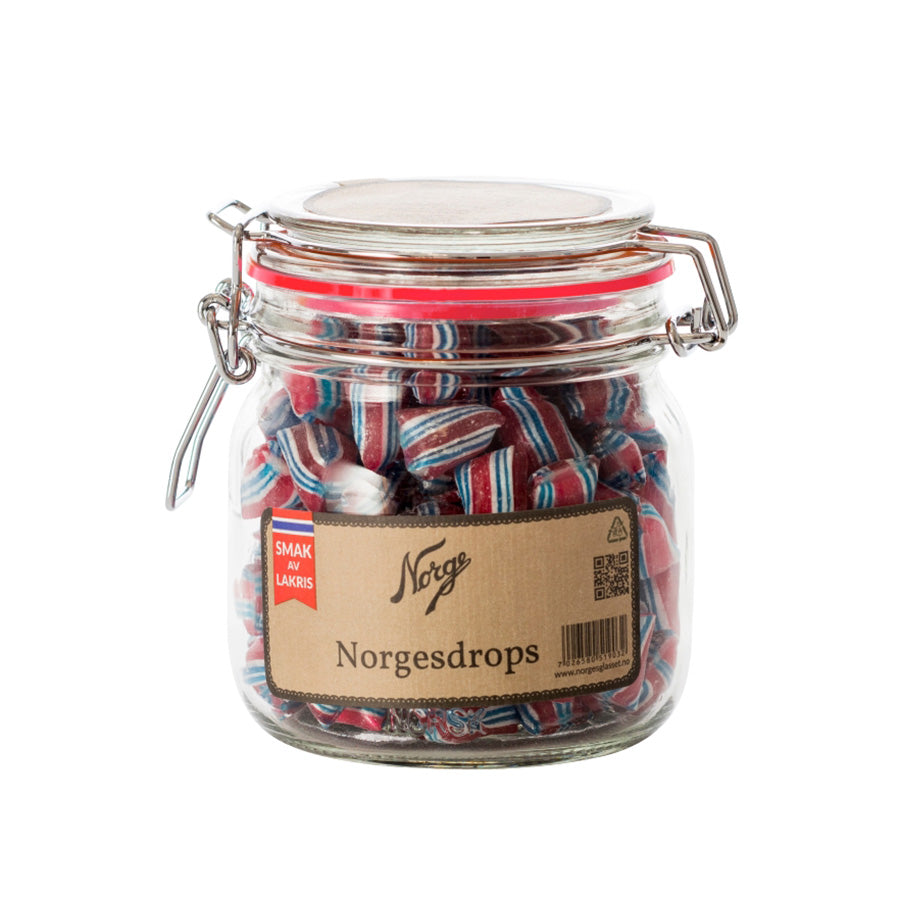 Norgesglasset med drops i rødt, hvitt og blått design inspirert av det norske flagget, perfekt til å nyte eller gi som gave.