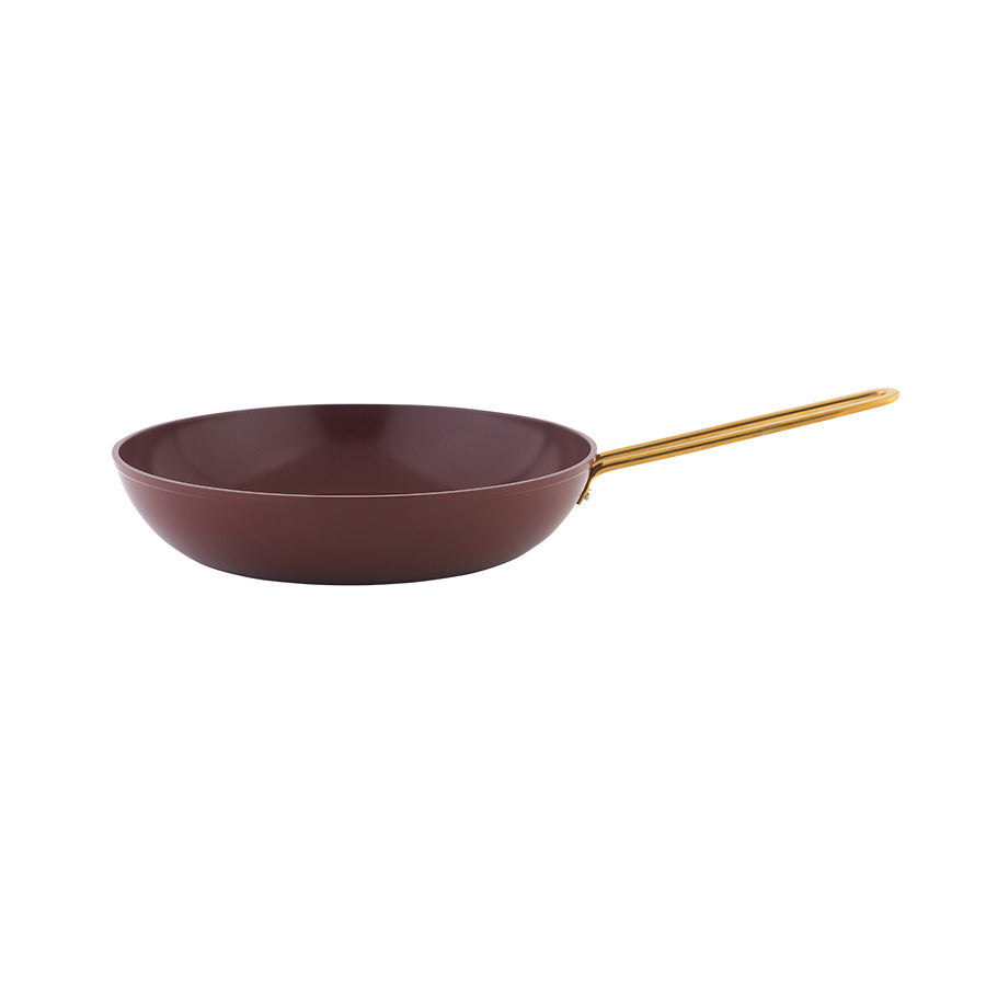 Minimalistisk burgunder stekepanne fra grytesett, designet for jevn varmefordeling.