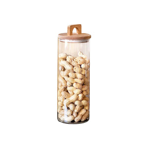 Oppbevaringsglass med lokk i akasietre fylt med peanøtter, 29 cm høyde, ideal for oppbevaring av tørrvarer.