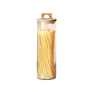 Oppbevaringsglass i klart glass med lokk i akasietre, perfekt for oppbevaring av pasta, tørrvarer og mer, 33 cm høyde.