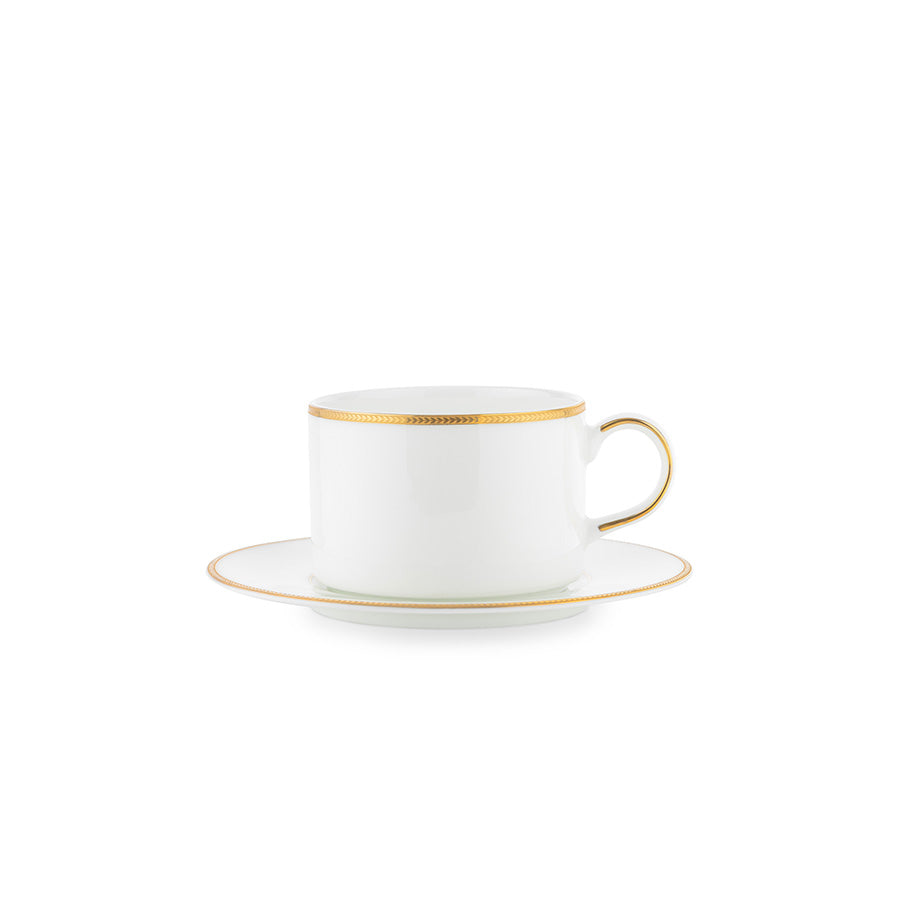 Kombinasjon av Porsgrund Porselænsfabrik Isabelle Gull Tekopp og skål, med klassisk design og luksuriøs gullkant.