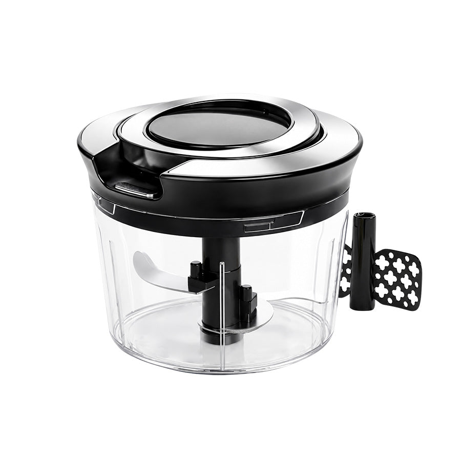 Christiania Glasmagasin Prep Minihakker 900ml med manuell trekk-mekanisme, designet for rask hakking av løk, hvitløk og urter. Den har en sklisikker base og er enkel å rengjøre, perfekt for matlaging til flere.