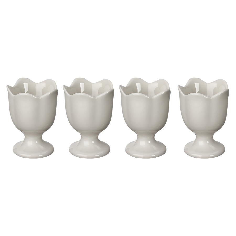 Seasons Spring Collection eggeglass 4pk, hvite 7 cm eggeglass i klassisk design, ideelle for frokost og servering, fra SEASONS. Eggeglassene gir støtte til egg i forskjellige størrelser.