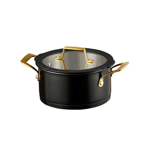 Lukket stålgryte fra Ask Obsidian grytesett, med klart lokk og messinghåndtak.