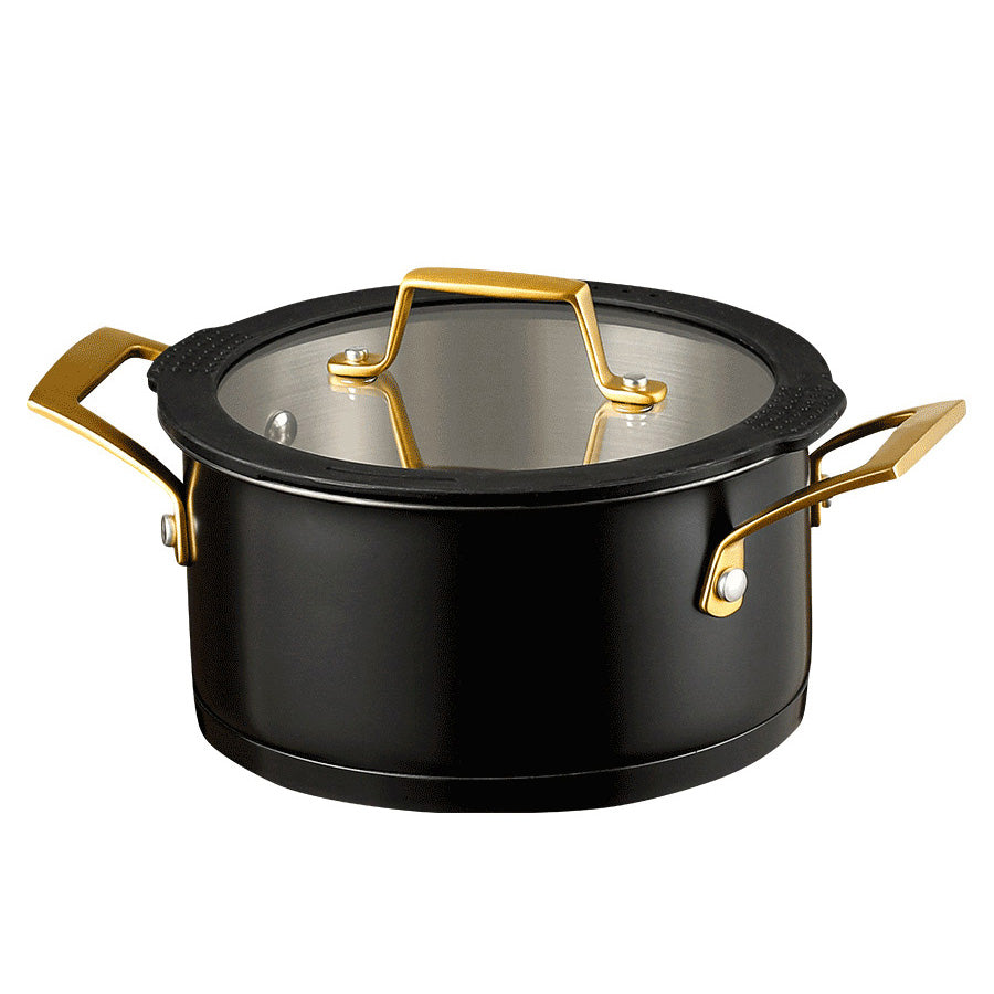 Åpen stålgryte fra Ask Obsidian grytesett, med klart lokk og dobbelt håndtak i messing.