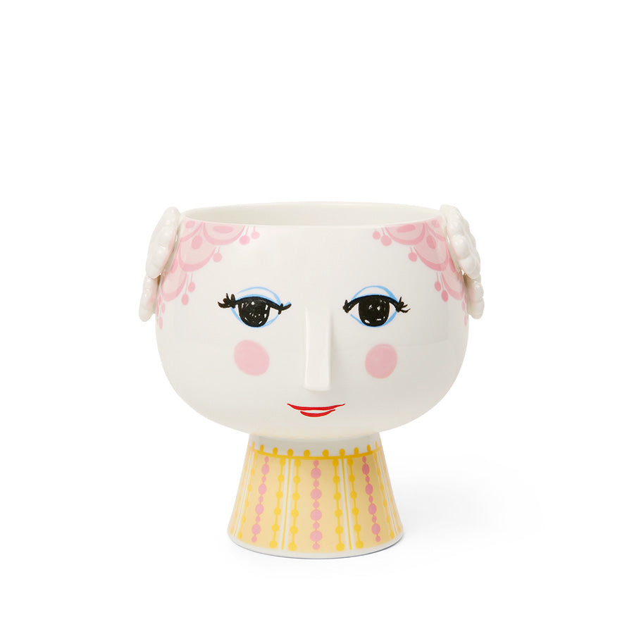 Lekker Bjørn Wiinblad potteskjuler med ansikt, dekorert med håndmalte detaljer i rosa og gult, perfekt for urter eller små blomster.