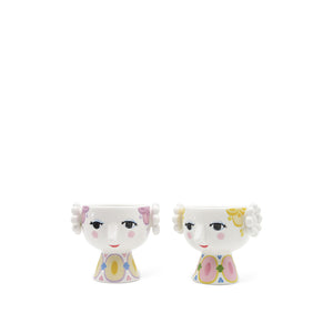 Sett med to unike Bjørn Wiinblad telysholdere i keramikk, en med lavendel og en med gul farge, perfekt for dekorasjon.