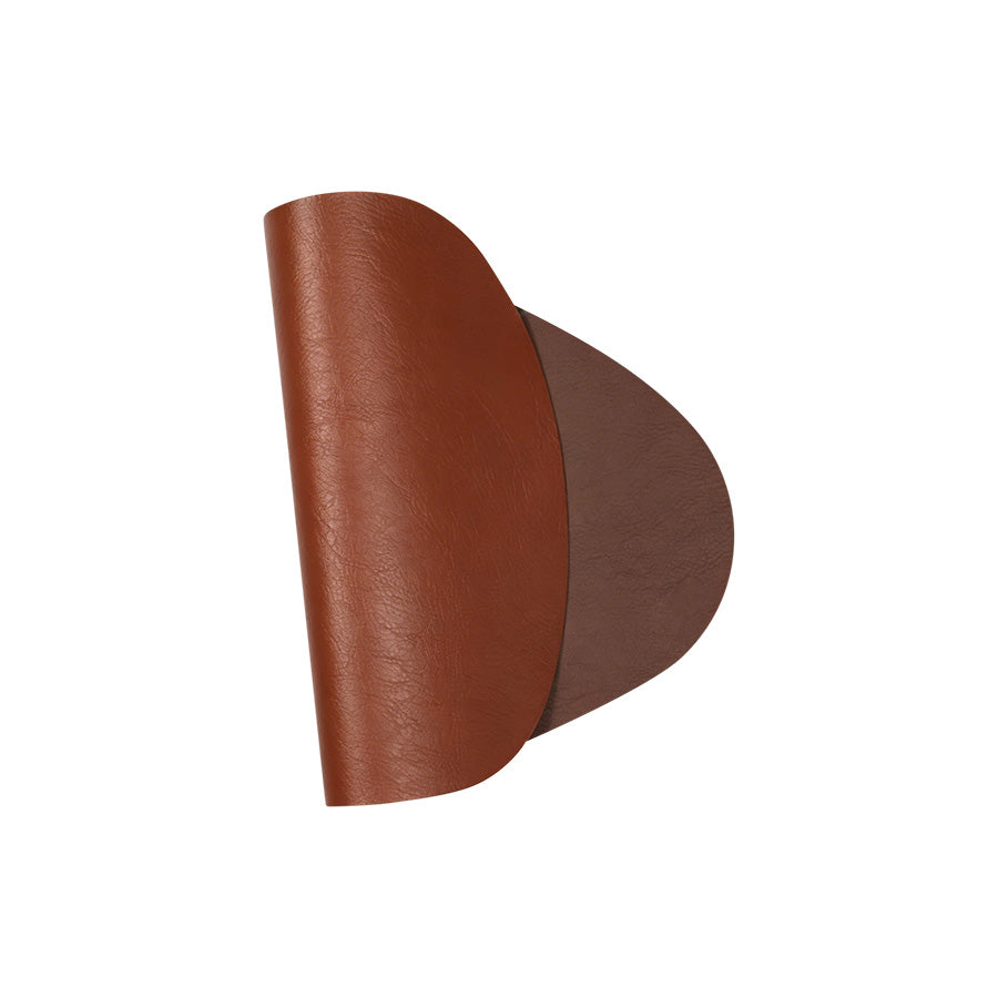 Egg-formet spisebrikke i brune nyanser, asymmetrisk design, perfekt for å sette en stilfull ramme på bordet.