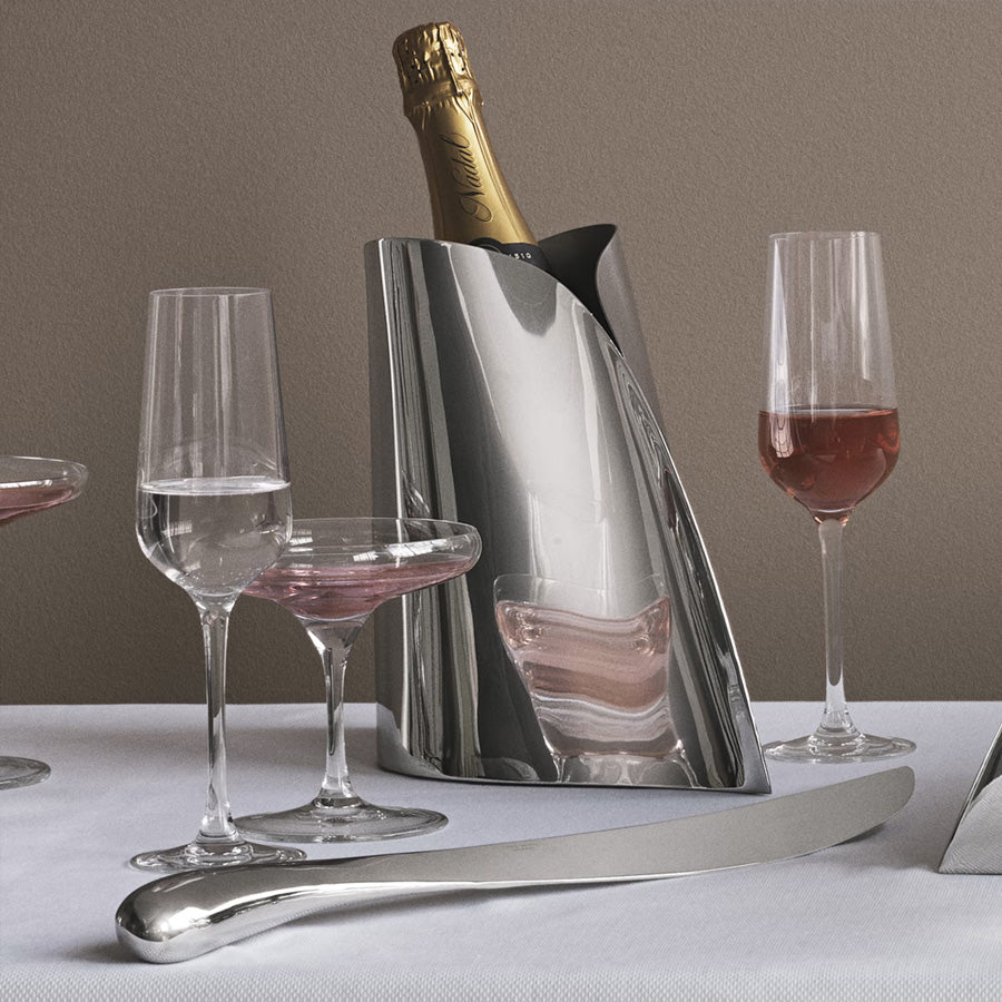 Georg Jensen Indulgence champagnesabel i blankt rustfritt stål, perfekt for å åpne champagneflasker med stil og skape feststemning.