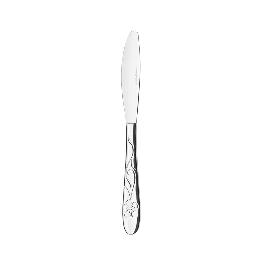 Skarp kniv fra bestikksettet, designet for både stil og funksjonalitet med blomstermønster.