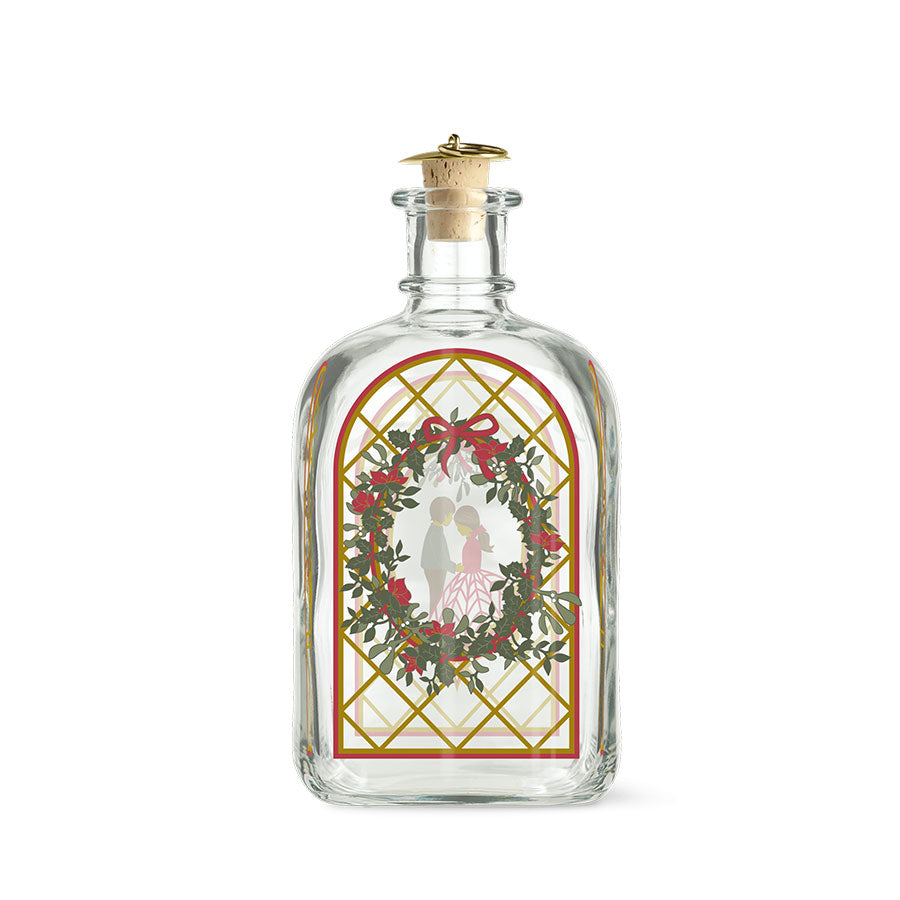 Holmegaard Christmas Juleflaske 2025 med romantisk juledekorasjon, designet av Jette Frölich. Flaske med illustrasjoner av julens symboler, perfekt for julesnaps.