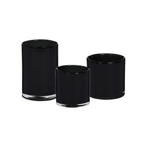 Sett med tre svarte lyslykter i blankt glass i ulike høyder - 8 cm, 10 cm, og 15 cm, perfekt for telys og kubbelys.