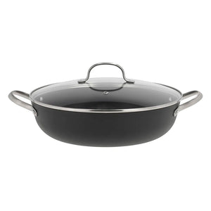 Støpejern wokpanne med glasslokk, perfekt for matlaging med jevn varmefordeling.