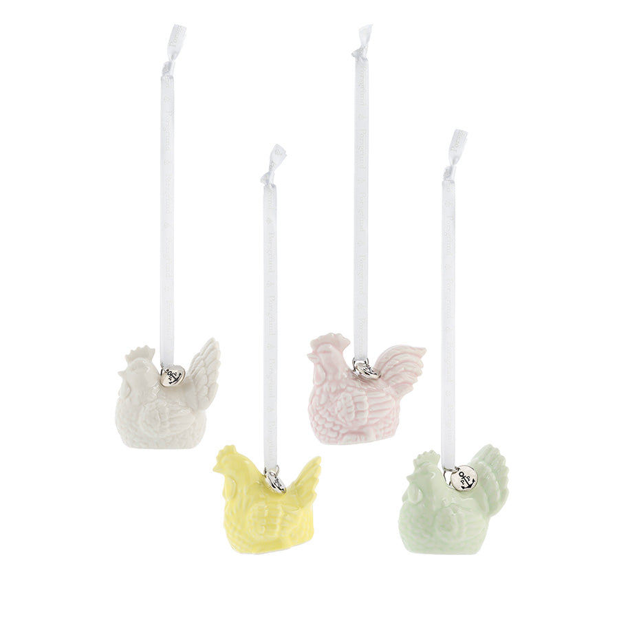 Søt 4-pack påskepynt med porselens høner i delikate farger, perfekte for påskedekorasjon.