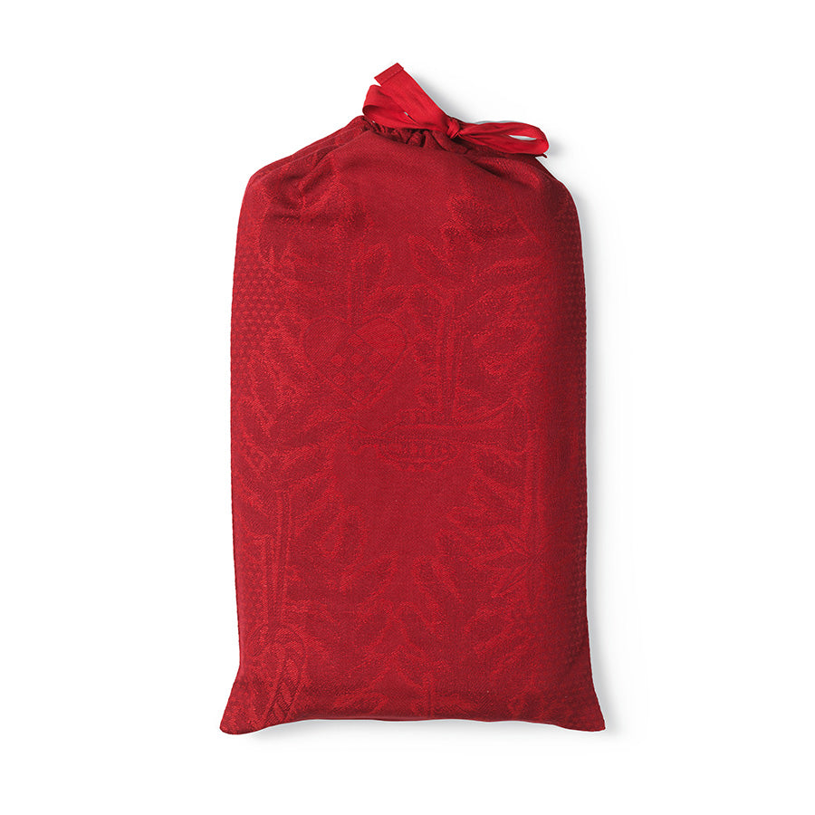 Elegant juleduk pakket i pose, laget av rød bomulls- og linblanding, klar for bruk.