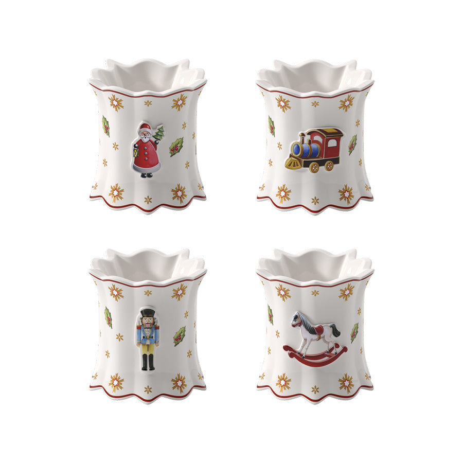 Villeroy & Boch Toy's Delight serviettringer i hvitt porselen med fire julefigurer: nisse, lokomotiv, nøtteknekker og gyngehest