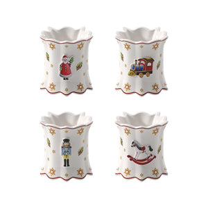 Villeroy & Boch Toy's Delight serviettringer i hvitt porselen med fire julefigurer: nisse, lokomotiv, nøtteknekker og gyngehest