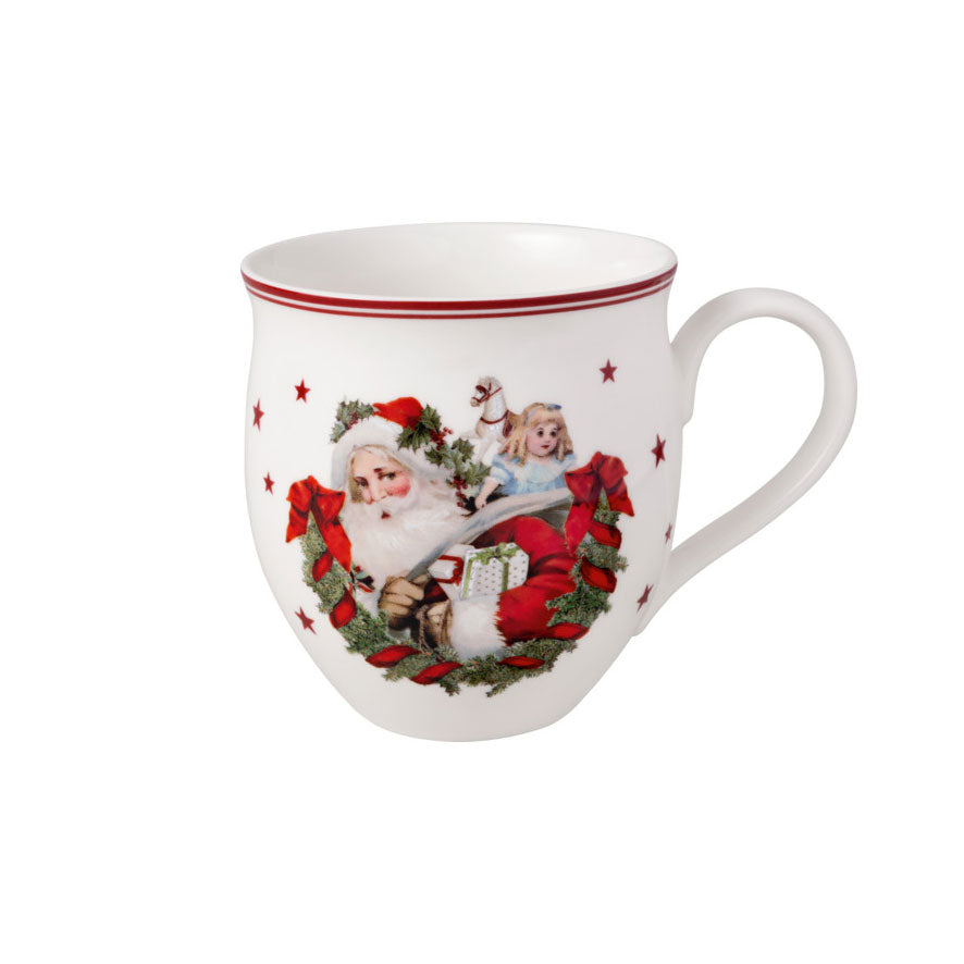 Villeroy & Boch julekopp med motiv av julenisse og gave, perfekt for varm drikke til jul. 390 ml kapasitet.